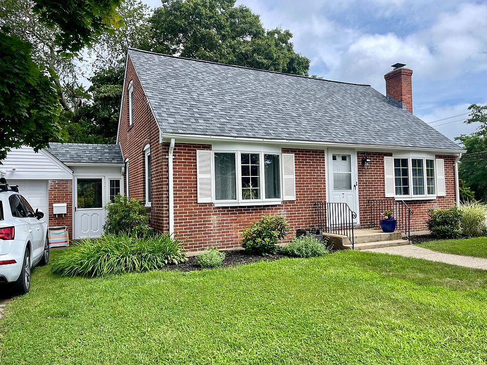 House view from the south side and front. Note, there is a detached garage with a passage way. Also, it has a new roof, that's why it looks a bit different from the other picture.