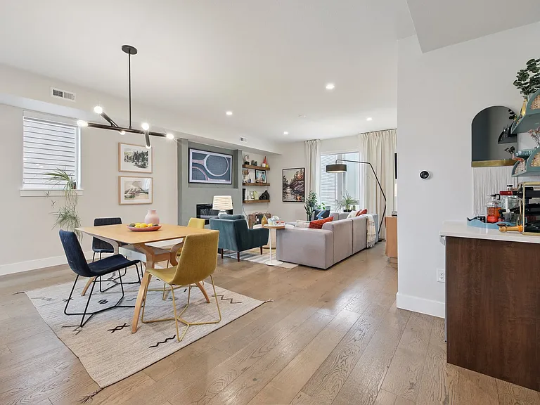Main level living area with built in bar and fridge