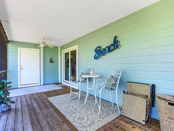 Screen in balcony sitting area with laundry room access.