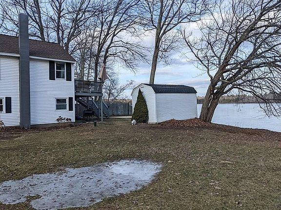 SIDE VIEW WITH SHED AND WATE