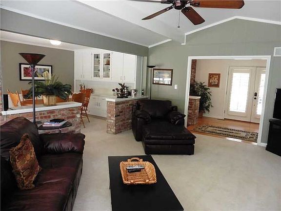 Great Room. The Great Room is open to the Dining Room and Entry.  This photo shows the various ceiling heights, and the general  architectural flavor of the home