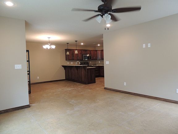 view from living room into kitchen/dining area
