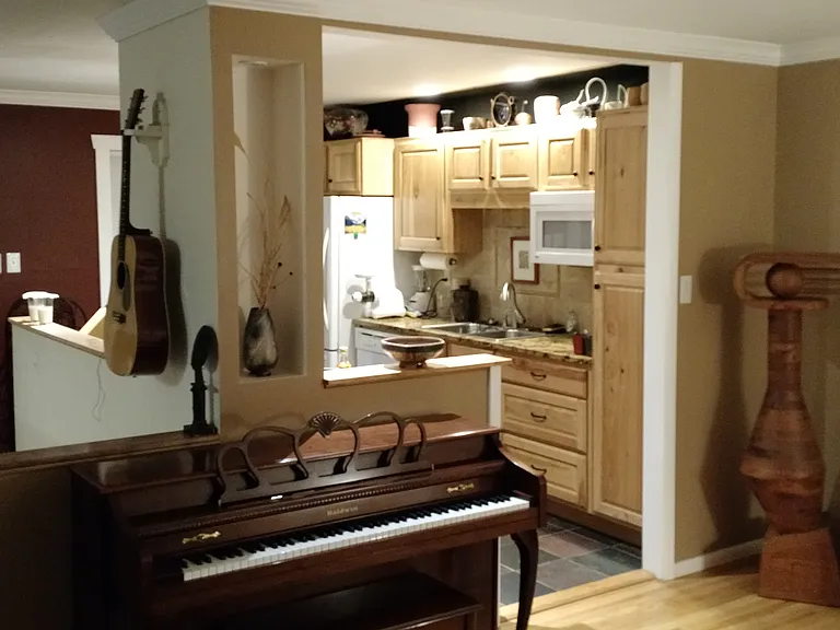 view of living room and kitchen from front door.