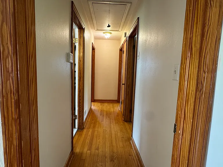 Full bath, first door on left. 
Primary bedroom, last door on left. 
Two additional , first and second doors on right.