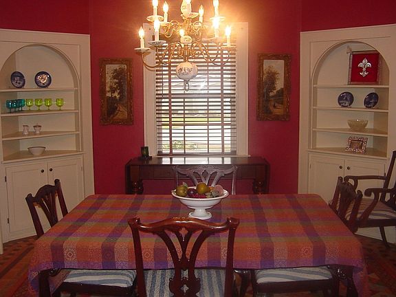 Formal dining room has original corner cabinets,
