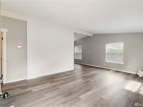 Welcome inside with a shiplap walls, vaulted ceilings and new trim & doors, paint and laminate floors.