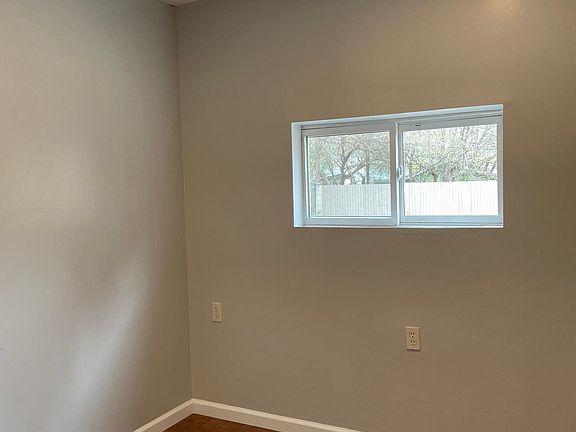 First bedroom. Both bedrooms have 2 overhead LED recessed lights in the ceiling.