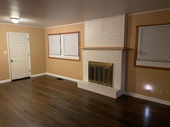 Oversized dining room with fireplace.