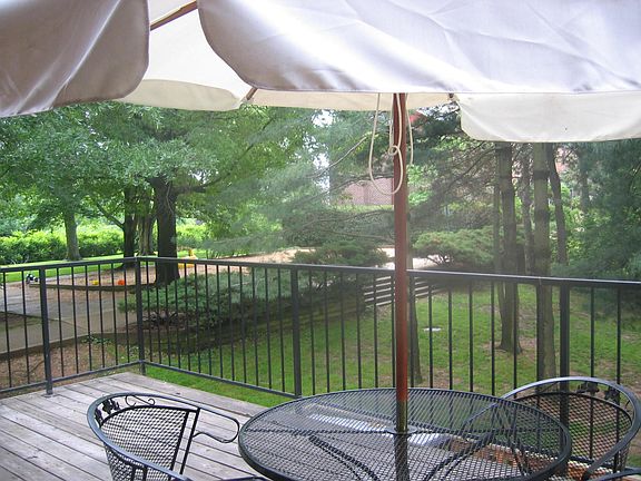Back view from oversized deck toward tot lot and golf course