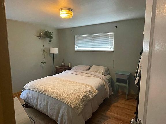Main bedroom. Has been updated with blackout shades and curtains.