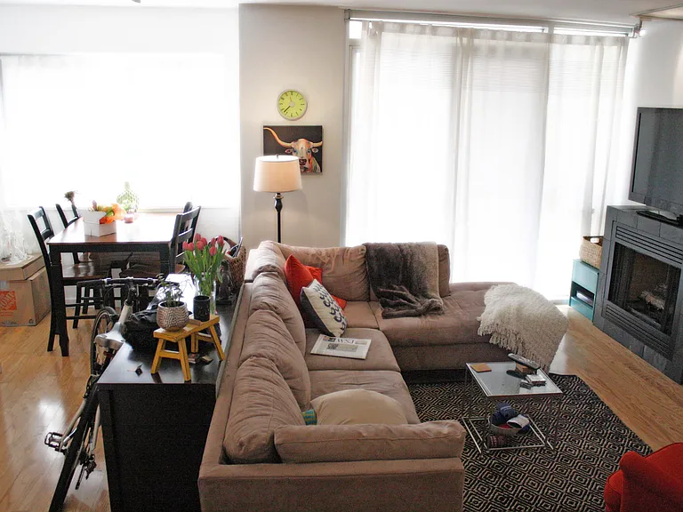 view of living space occupied with furniture (flooring has since been replaced)