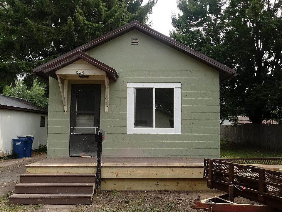 Front of house with front deck area.