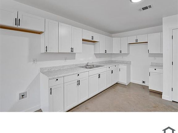 Renovated kitchen area featuring new cabinetry and a spacious layout.