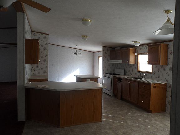 Spacious eat in kitchen with bar and island.