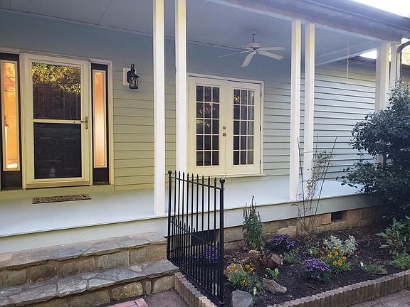 Front porch, flowers, and herbs