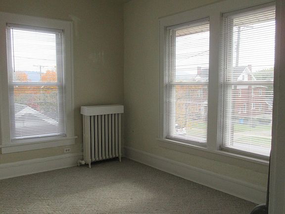 bedroom-two windows front of house one by side of porch steps