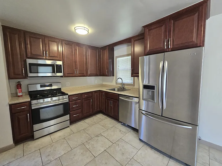 Kitchen with stainless steel appliances.