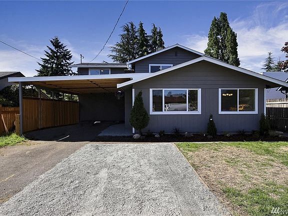 Amazing remodeled home. Enter to cozy living area w/ gas fireplace. New wood flooring on main. Across from living area is a second living space w/ views to oversized backyard. Expand living space outdoors onto lovely new deck. Mn flr also includes new kitchen with high end millwork and finishes. Lrge bedroom on frst flr w/ custom walk-in closet will delight. A full bath completes the mn floor. 4 bdrooms up with all new carpet & lighting. Full bath up w/ soaking tub and separate tiled shower.