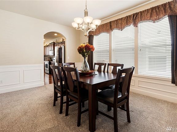 Formal dining room, upgraded trim pkg with shadow boxing and chair rail. 