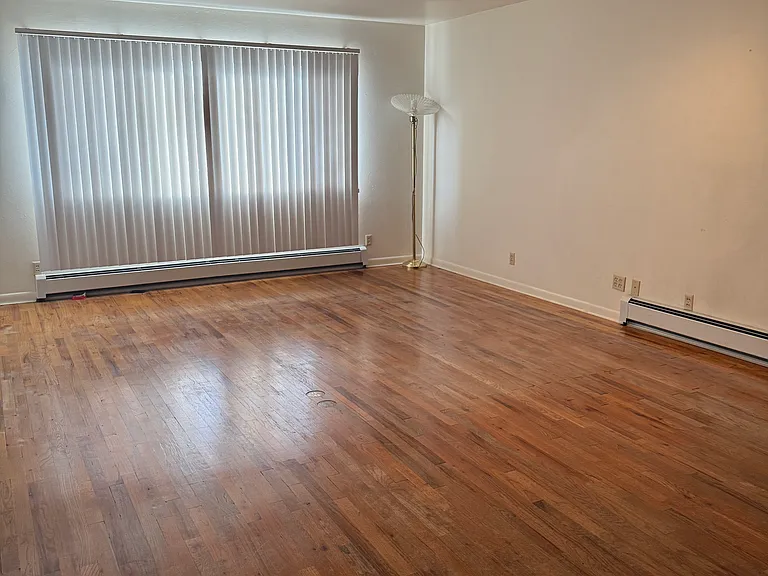 long view of living room and hardwood floor