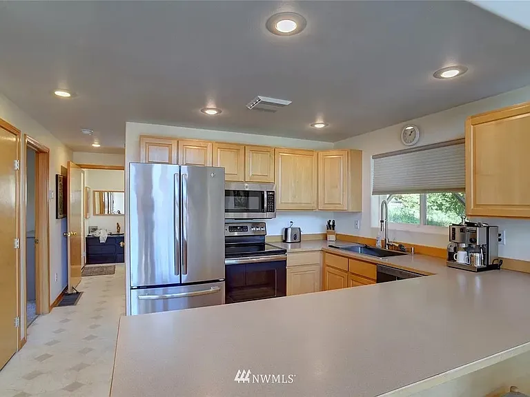 Kitchen with appliances - refrigerator with bottom freezer, cooking range (electric), microwave, oven, coffee machine