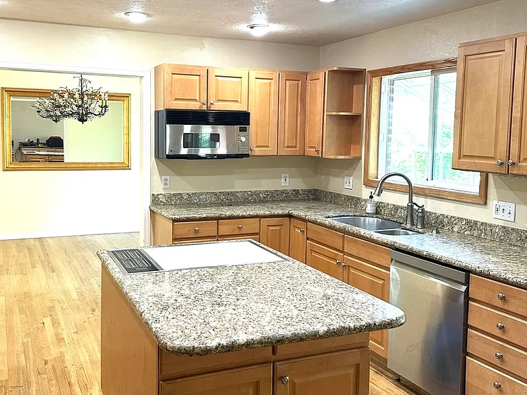 Kitchen, facing dining room mirror; sunroom sliding door is to the right