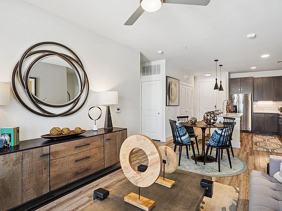 Kitchen, living, and dining area with hard surface flooring