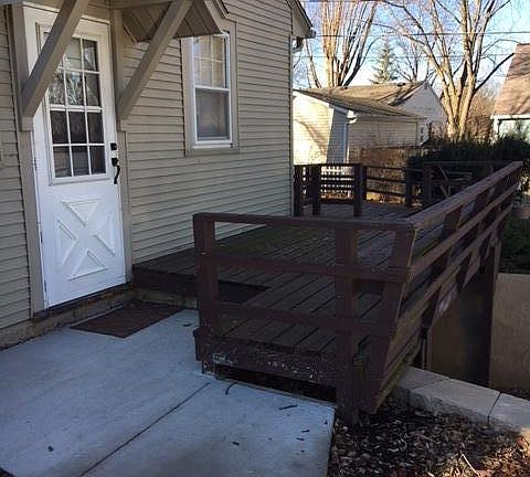 Side door with wrap around deck to back of house