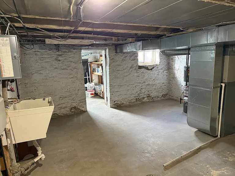 Lower level with laundry hook-ups and plenty of storage space. Separate from the other side of the duplex.
