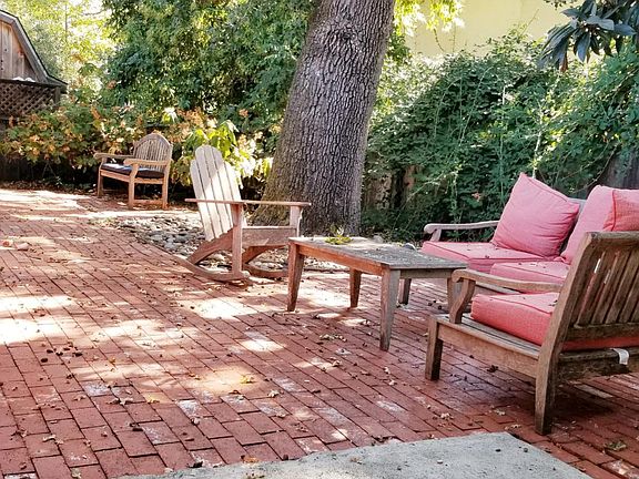 Two oak trees provide beautiful dappled sunlight and shade all day