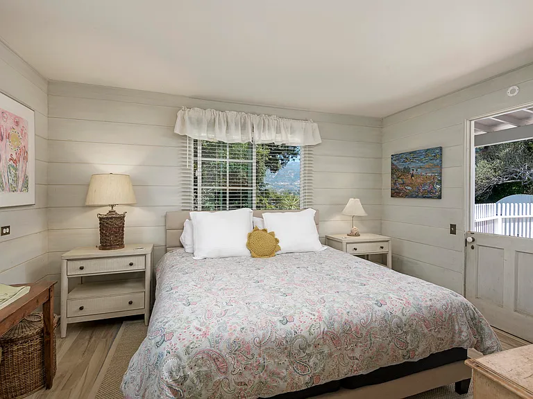2nd king bedroom with private entrance from courtyard. This bedroom shares a full bath with our twin bedroom that also has a private entrance from the courtyard. Flat screen tv not shown.