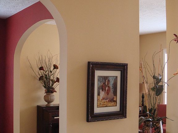 Great arched entrances into formal living & dining rooms