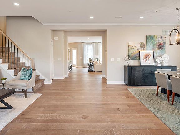 The foyer with flanking dining and living rooms
