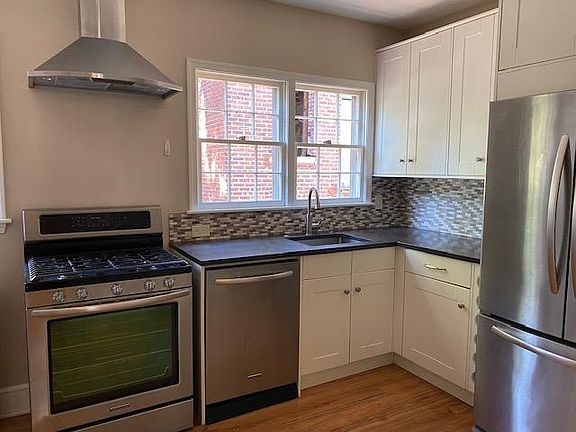 Updated kitchen includes dishwasher, gas range w/ convection oven, and new fridge.