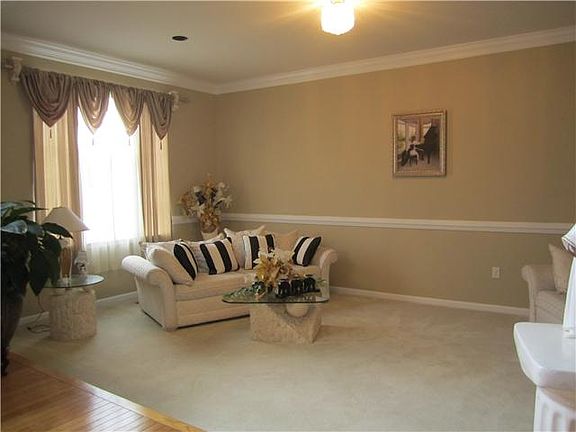 Sunken living room with decorative molding!