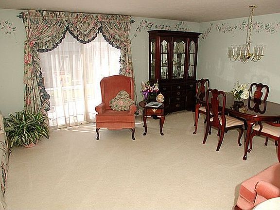 Bright living room with sliding glass doors to deck