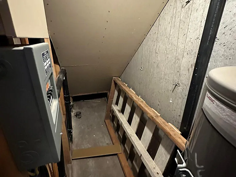 Under stairwell storage for extra items.