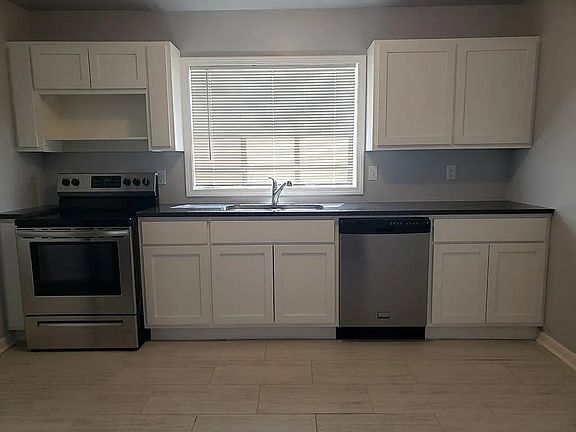 Kitchen remodeled a few years back, very nice with Dishwasher, refrigerator and over/stove combo included.
