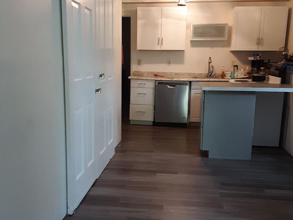 Apt 1 - Open concept LR/Kitchen with island, doors to Bedroom #2