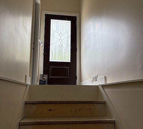 stairs from entrance going down to apartment