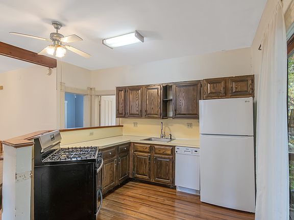 Kitchen with Dishwasher and Stainless Steel Oven