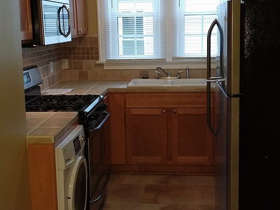 Full kitchen w/new tile, counter, cabinets, sinks - all high