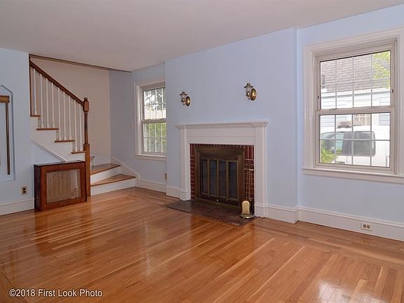 Sun filled front to back living room. Freshly painted and newly refinished hardwoods.