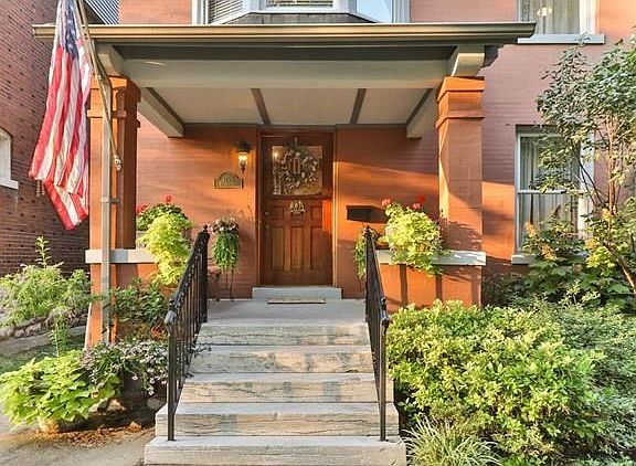 Inviting entryway with lush plantings.