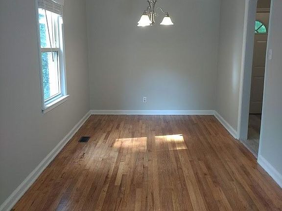 Bright dining space, kitchen to the right.