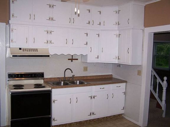 Kitchen with new sink and counter tops.