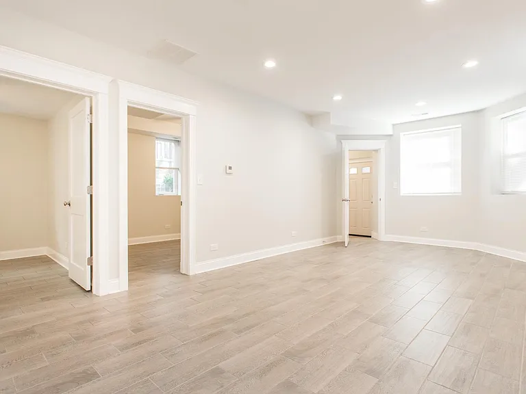 Living room facing bedrooms and front entry
