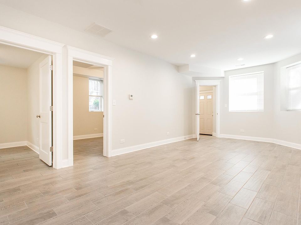 Living room facing bedrooms and front entry