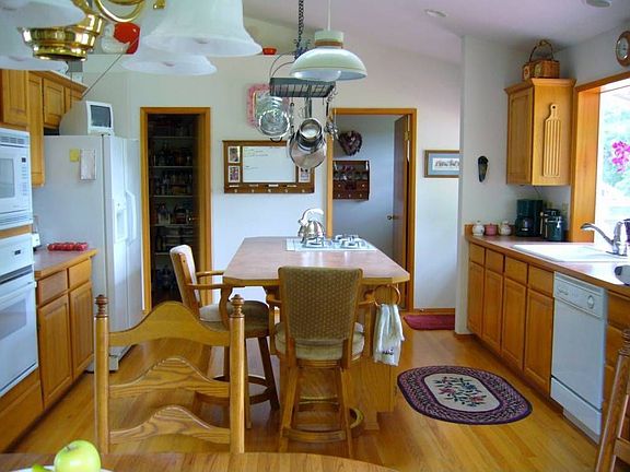 Large bright island kitchen with large garden window