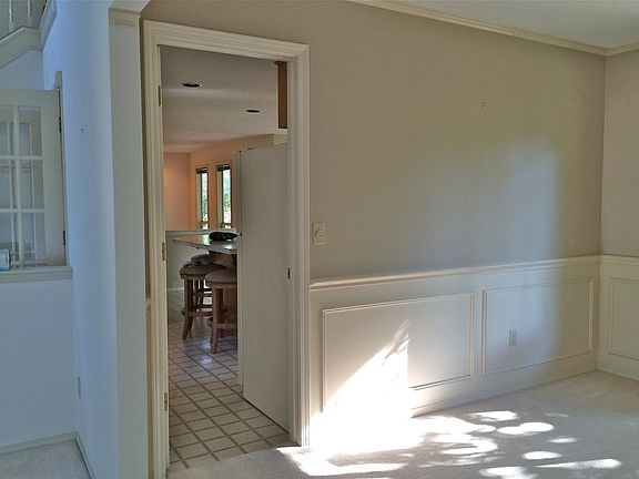 dining room with passage in to kitchen